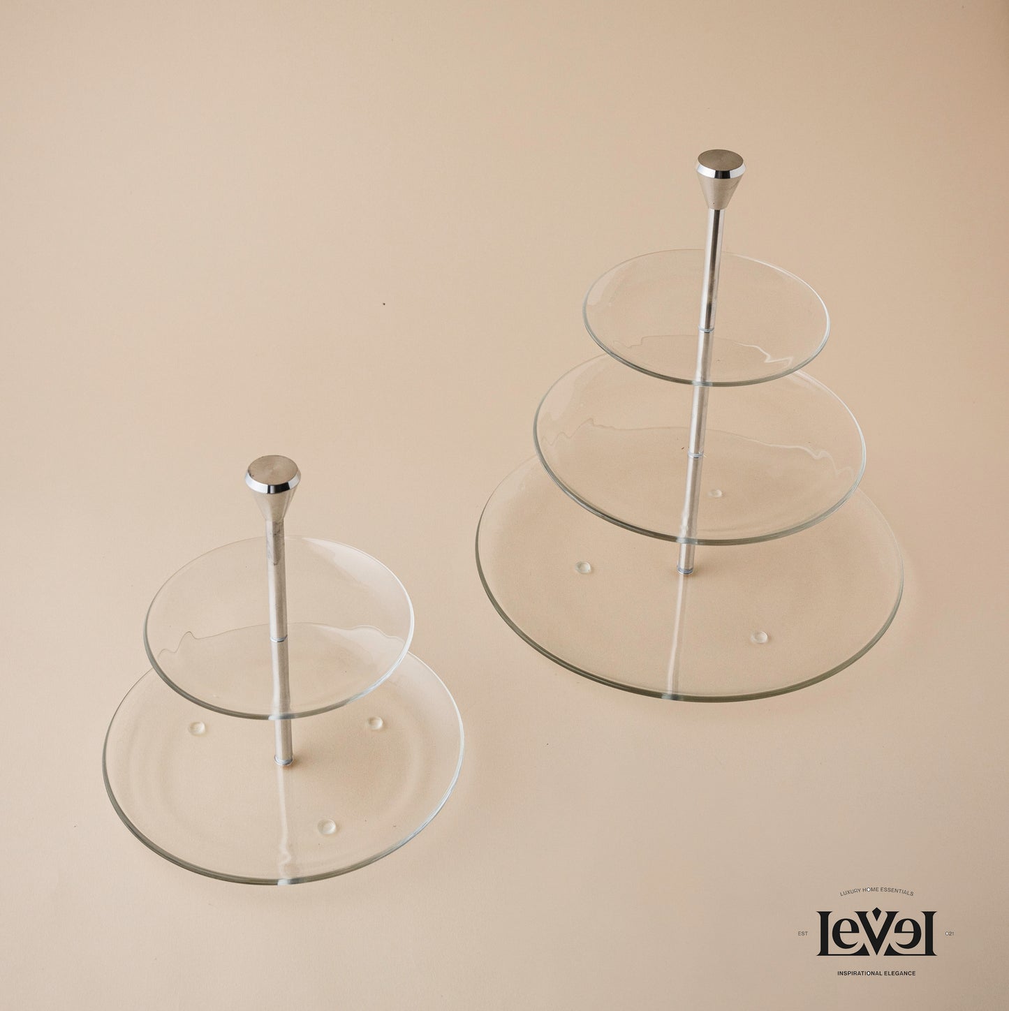 Two layer glass stand with silver handle